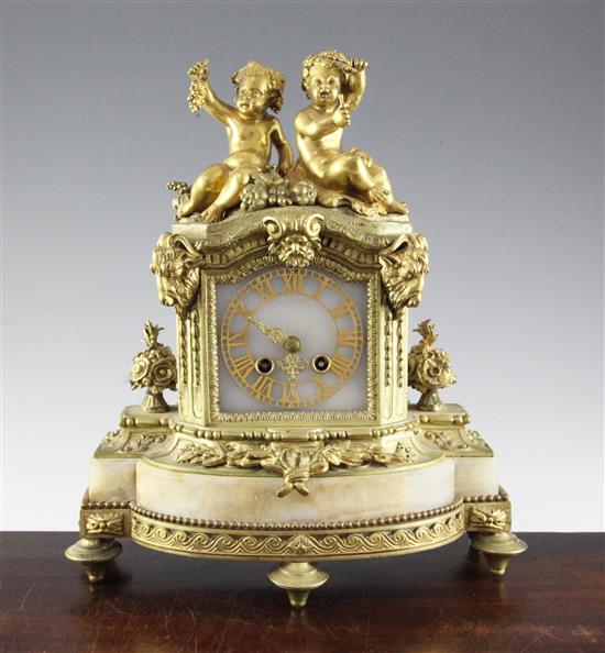 A 19th century French ormolu mounted onyx mantel clock, H.14in.